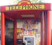 1024px-Phone_box_prostitute_calling_cards_1_crop.jpg